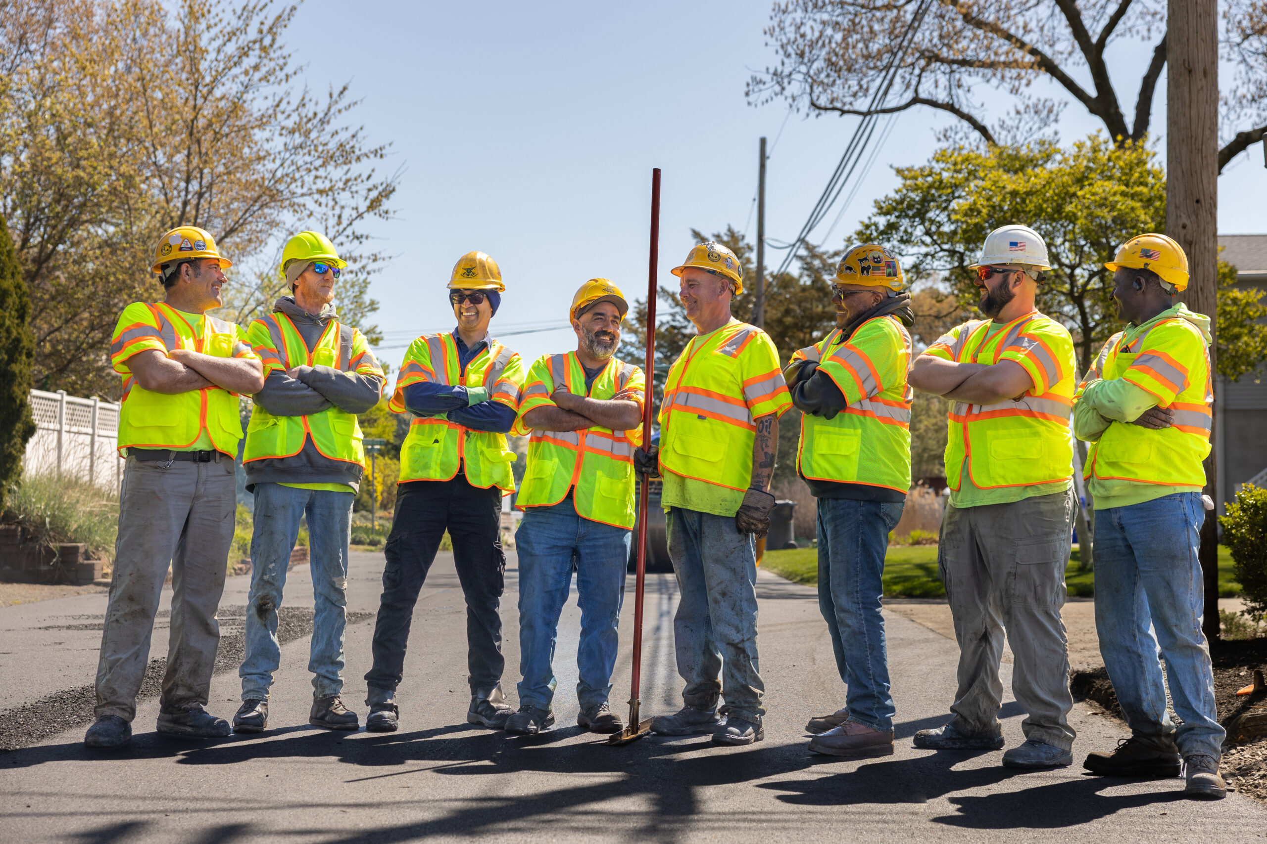 American Asphalt team members smiling at job site